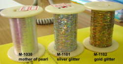 Metallic yarns with silver or gold glitter effect and mother of pearl effect