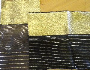 Plasma Gold coated Polyester dtex 168 f 14 in the weft on a black silk warp
