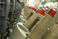 Winding flax tow yarn which is cleaned from all impurities